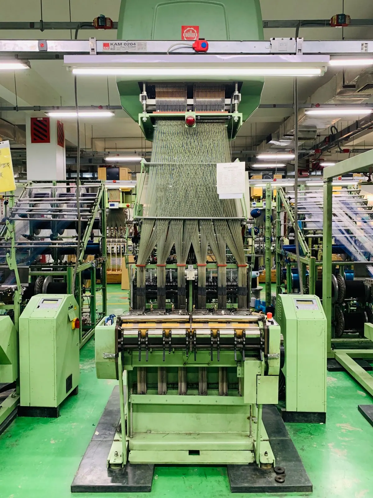Knits yarn into fabric for apparel and household textiles.