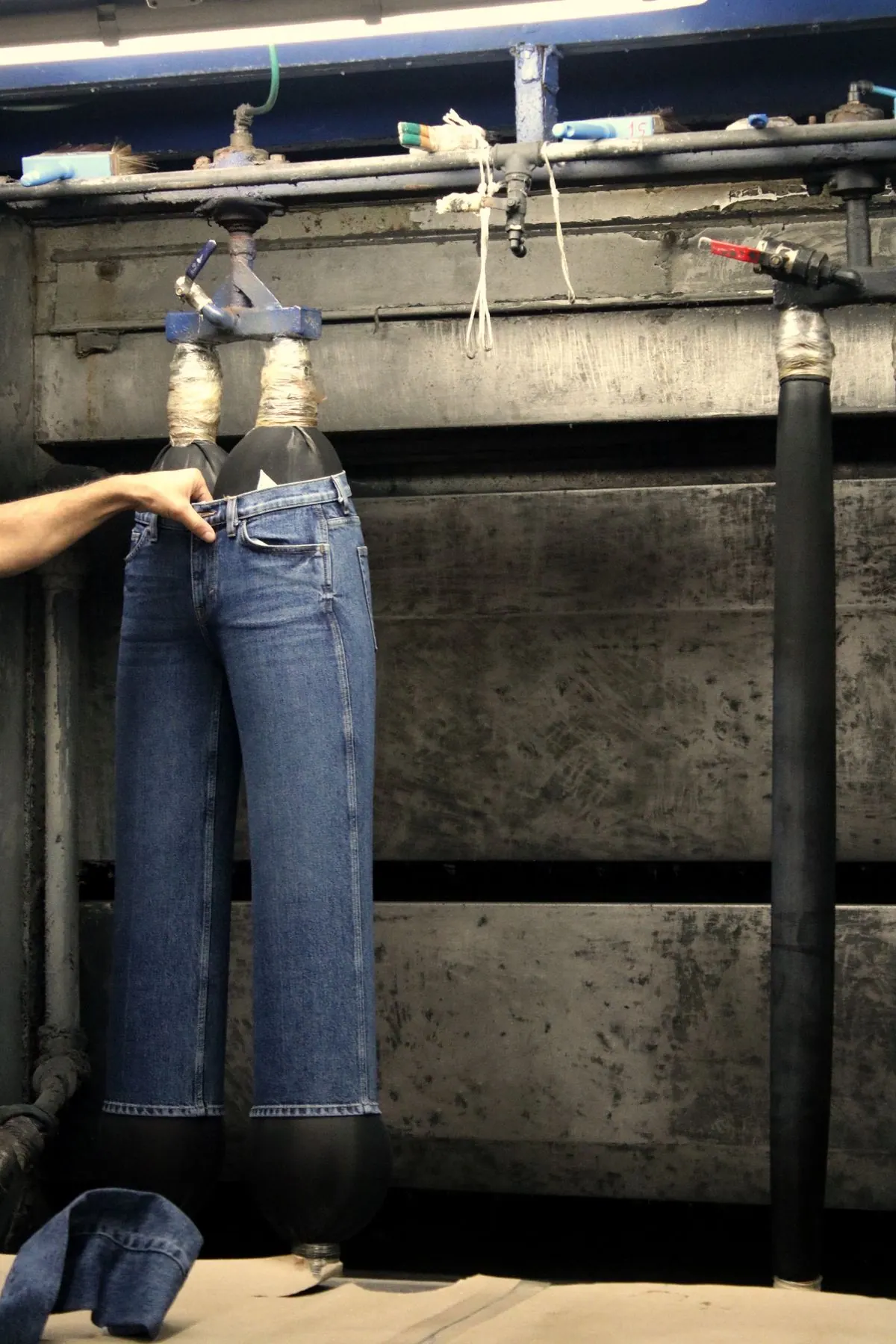 Washes, distresses and finishes denim garments to the required shade and hand-feel.